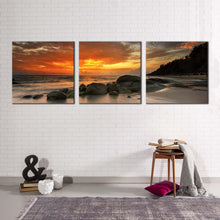 Load image into Gallery viewer, boulders  seascape  canvas  wall  art  orange  cloudy  sky  canvas  print  yellow  ocean  rocks  beach  3  piece  canvas  set
