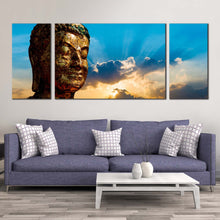 Load image into Gallery viewer, buddha  face  canvas  print  blue  sky  buddha  statue  canvas  set  brown  buddha  3  piece  canvas  wall  art In Living Room
