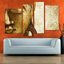 Load image into Gallery viewer, buddha face canvas wall art statue close up multiple canvas gold buddha mind and soul canvas print yellow peaceful buddha 4 piece canvas in living room
