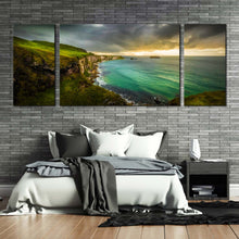 Load image into Gallery viewer, carrick  sea  canvas  print  green  ireland  ocean  3  piece  canvas  wall  art  yellow  sunset  coastline  ocean  triptych  canvas  set In Living Room
