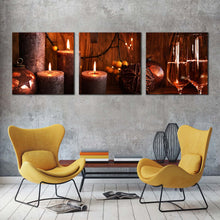 Load image into Gallery viewer, champagne  glasses  canvas  wall  art  champagne  and  brown  candles  3  piece  canvas  print  orange  champagne  in  christmas  multi  canvas  artwork In Living Room
