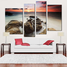 Load image into Gallery viewer, cloudy sea canvas wall art red orange sky ocean canvas print brown ocean rocks boulders 4 piece canvas for living room
