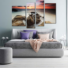 Load image into Gallery viewer, cloudy sea canvas wall art red orange sky ocean canvas print brown ocean rocks boulders 4 piece canvas
