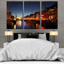 Load image into Gallery viewer, copenhagen harbor kayak Scenic Harbor at Sunset 3 Piece Canvas Art Print In Bedroom
