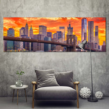 Load image into Gallery viewer, downtown  nyc  canvas  wall  art  orange  yellow  dramatic  clouds  cityscape  canvas  artwork  brown  brooklyn  bridge  panoramic  canvas  print In Living Room
