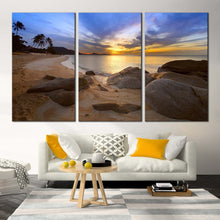 Load image into Gallery viewer, dramatic clouds canvas wall art blue sea ocean rocks 3 piece canvas artwork brown stony beach ocean canvas print In Living Room
