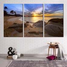 Load image into Gallery viewer, dramatic clouds canvas wall art blue sea ocean rocks 3 piece canvas artwork brown stony beach ocean canvas print
