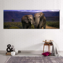 Load image into Gallery viewer, elephant  hug  canvas  wall  art  grey  elephant  love  panoramic  canvas  print  elephant  in  green  nature  wide  canvas In Living Room
