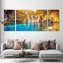 Load image into Gallery viewer, forest  waterfall  canvas  wall  art  blue  water  forest  nature  multi  canvas  yellow  green  trees  canvas  set  lakes  national  park  waterfall  3  piece  canvas  print In Living Room
