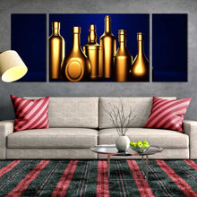 Load image into Gallery viewer, golden liquor bottles blue background triptych canvas prints In Living Room
