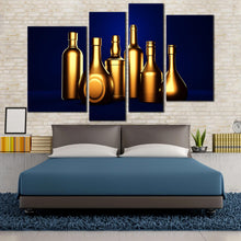 Load image into Gallery viewer, golden liquor bottles in blue background 4 piece canvas prints
