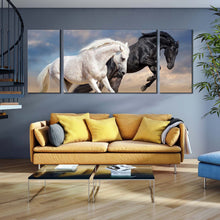 Load image into Gallery viewer, horse  animal  canvas  wall  art  two  horses  running  dust  3  piece  canvas  print  black  and  white  horses  couple  multiple  canvas In Living Room
