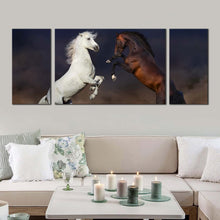 Load image into Gallery viewer, horse  fight  canvas  wall  art  white  brown  horses  3  piece  canvas  set  two  horses  at  desert  triptych  canvas  print In Living Room
