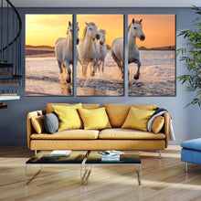 Load image into Gallery viewer, horses beach canvas wall art white horses sea 3 piece multiple canvas horses yellow sunset sky triptych canvas print In Living Room
