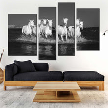 Load image into Gallery viewer, horses galloping canvas wall art white horses herd in water 4 piece multiple canvas grey horses dark background canvas print
