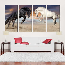 Load image into Gallery viewer, horses rearing canvas wall art white black horses 4 piece canvas set horses fight canvas print In Living Room
