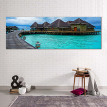 Load image into Gallery viewer, maldives  ocean  canvas  wall  art  hotel  on  blue  water  1  piece  canvas  print  brown  wooden  bridge  sea  wide  canvas In Living Room
