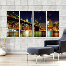 Load image into Gallery viewer, manhattan skyline canvas wall art colorful new york city lights 4 piece canvas print blue sky brooklyn bridge cityscape canvas set In Your Living room
