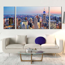 Load image into Gallery viewer, manhattan sunset canvas wall art blue nyc at dawn 3 piece canvas print yellow new york city skyline triptych multi canvas In Living Room
