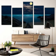 Load image into Gallery viewer, moon ocean canvas wall art blue cloudy full moon ocean 5 piece canvas print brown rock beach at night multi canvas artwork In Living room
