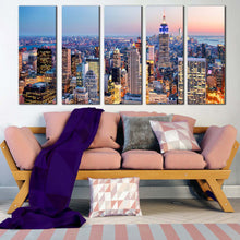 Load image into Gallery viewer, new york city canvas print blue midtown manhattan cityscape 5 piece canvas wall art yellow sky empire state building canvas set In Living Room
