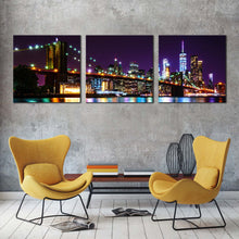 Load image into Gallery viewer, nyc  manhattan  canvas  wall  art  colorful  new  york  cityscape  multiple  canvas  brooklyn  bridge  at  night  3  piece  canvas  print In Living Room
