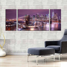 Load image into Gallery viewer, nyc river canvas wall art purple sky manhattan digital painting 3 piece canvas set brown brooklyn bridge cityscape triptych canvas print In Living Room
