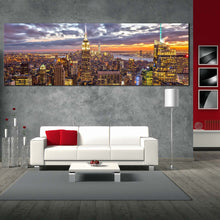 Load image into Gallery viewer, nyc  skyline  canvas  wall  art  yellow  new  york  city  panoramic  canvas  print  grey  manhattan  dramatic  skies  wide  canvas In Living Room
