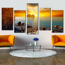 Load image into Gallery viewer, ocean boulders canvas wall art blue sea ocean rocks 5 piece canvas print yellow orange cloudy sunset sky multi canvas artwork In Living room
