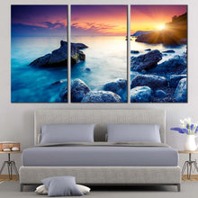 Load image into Gallery viewer, ocean boulders canvas wall art dramatic yellow sunset sky canvas print crimea ukraine blue ocean rocks 3 piece canvas set In Bedroom
