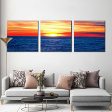 Load image into Gallery viewer, ocean  clouds  canvas  wall  art  orange  yellow  sunset  ocean  canvas  print  dramatic  blue  sea  waves  3  piece  canvas  set In Living Room
