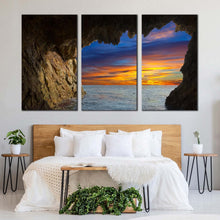 Load image into Gallery viewer, ocean mountain canvas wall art dramatic orange sky ocean arches 3 piece canvas brown cave ocean view canvas print In Bedroom
