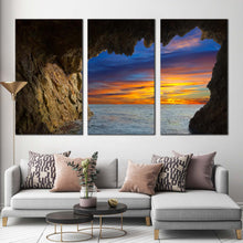 Load image into Gallery viewer, ocean mountain canvas wall art dramatic orange sky ocean arches 3 piece canvas brown cave ocean view canvas print In Living Room
