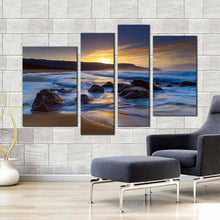 Load image into Gallery viewer, ocean rocks canvas wall art australia blue ocean canvas print yellow sunset killcare beach 4 piece canvas set in living room
