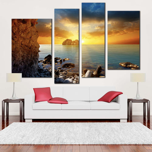 ocean rocks canvas wall art dramatic yellow cloudy sunset sky 4 piece multiple canvas blue sea ocean boulders canvas print in living room