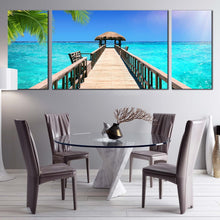 Load image into Gallery viewer, ocean sky canvas print blue tropical paradise ocean 3 piece canvas wall art brown wooden pier canvas set In Dining Room
