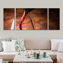 Load image into Gallery viewer, poured wine canvas print red wine liquid canvas print black wine bottle 3 piece multi canvas artwork wine glass close up canvas wall art In Living Room
