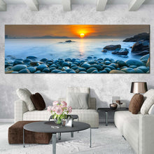 Load image into Gallery viewer, stony  beach  canvas  wall  art  quy  nhon  bay  blue  ocean  canvas  artwork  vietnam  orange  sunrise  ocean  sky  panoramic  canvas  print In Living Room
