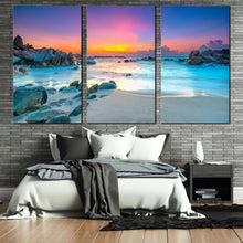 Load image into Gallery viewer, stony beach canvas wall art yellow sky ocean rocks sea 3 piece canvas print blue ocean water triptych multi canvas For Bedroom
