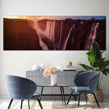 Load image into Gallery viewer, victoria  falls  canvas  wall  art  zimbabwe  yellow  cloudy  sunset  waterfall  canvas  print  orange  zambezi  river  waterfall  nature  panorama  canvas In Living Room
