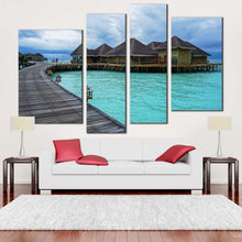 Load image into Gallery viewer, water villa canvas wall art blue ocean wooden bridge 4 piece canvas print brown hotel on water multiple canvas for your living room 
