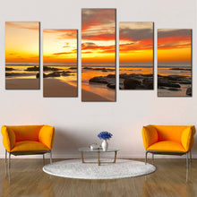Load image into Gallery viewer, yellow sea with blulders at sunset 5 Piece photography prints in living room
