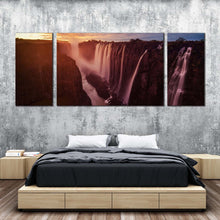 Load image into Gallery viewer, zimbabwe waterfall canvas wall art orange zambezi river waterfall nature 3 piece canvas set yellow sunset sky victoria falls canvas print In Bedroom
